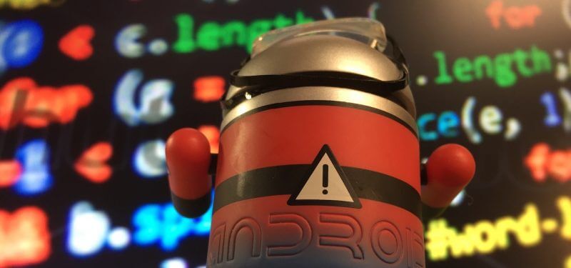 Android figure with code in the background