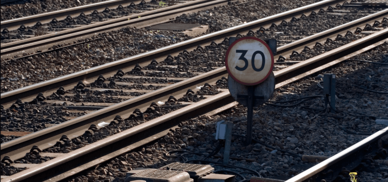 Number 30 sign on railroad tracks