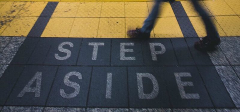 Step Aside written on ground