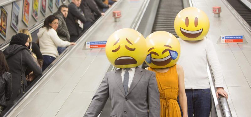 People with emoji masks