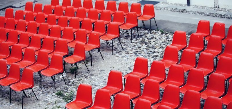 Rows of empty red chairs