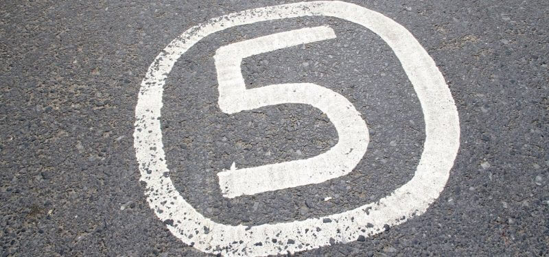 Number 5 painted on asphalt