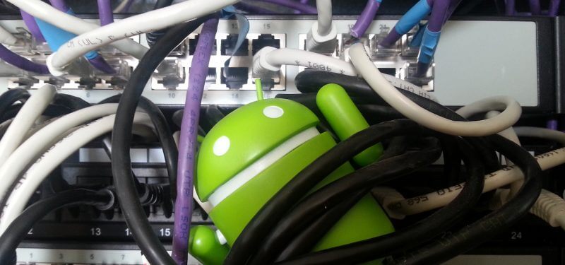 Android mascot tangled in ethernet cords