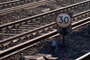 Number 30 sign on railroad tracks
