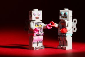 Lego robots holding hands
