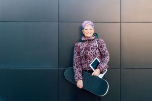 Trendy grandmother with skateboard