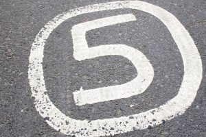 Number 5 painted on asphalt
