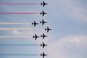 The Royal Air Force Aerobatic Team, the Red Arrows, in formation at Bournemouth Air Show 2020. Photo by Trey Musk on Unsplash