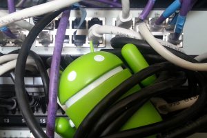 Android mascot tangled in ethernet cords