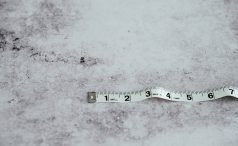 White tape measure on white background 