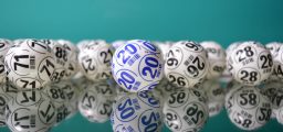 White bingo balls with black and blue nuumbers