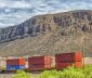 Containers moving through the desert