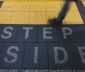 Step Aside written on ground